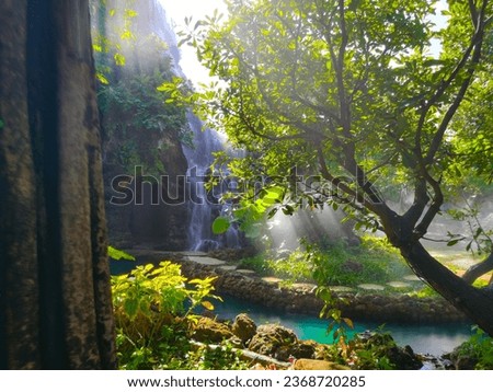 A beautiful green artificial waterfall in a relaxing place in Chiang Mai.