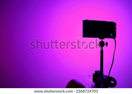 lilac gradient on the surface, light from the LED panel. stage lighting