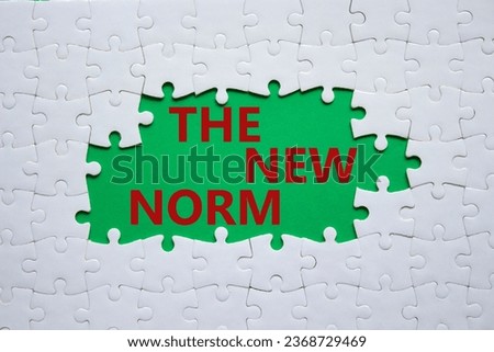 The new norm symbol. Concept words The new norm on white puzzle. Beautiful green background. Business and The new norm concept. Copy space. Royalty-Free Stock Photo #2368729469