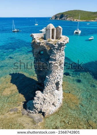 Aerial view of Corsica's step coastline and a lighthouse along the Sentier des Douaniers hiking trail Royalty-Free Stock Photo #2368742801