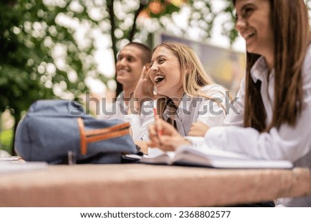 Happy students having fun and laughing after classes