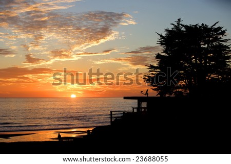 Beach House at sunset on the pacific