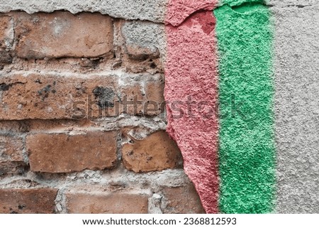 Red green white stripes on the wall. Football club flag zaglebie, Poland. The symbol of the Polish sports team in street art style. Place for text, posters, schedules, game scores.