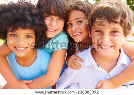 Group Of Children Giving Each Other Piggyback Rides Royalty-Free Stock Photo #236885392
