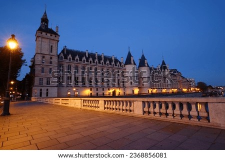 Conciergerie Building in Paris, France at night .