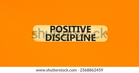 Positive discipline symbol. Concept words Positive discipline on beautiful wooden stick. Beautiful orange table orange background. Business psychology positive discipline concept. Copy space.
