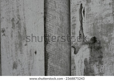 Closeup picture of old rustic wooden planks eaten by caries.weathered wooden walls were eaten by termites