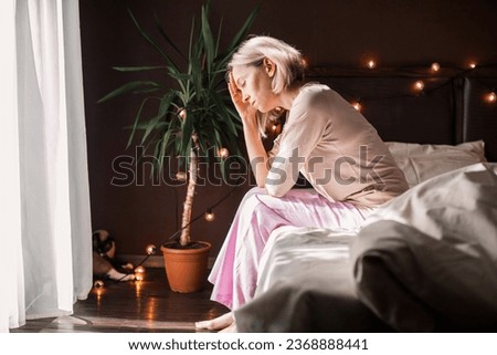 Upset distressed middle aged woman sit on floor in bedroom cry having emotional personal problems breakup or divorce, depressed sad female feel down stressed suffer from infertility or depression  Royalty-Free Stock Photo #2368888441