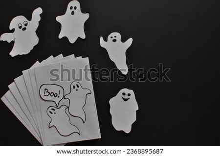 funny halloween cards with ghosts on the black background 