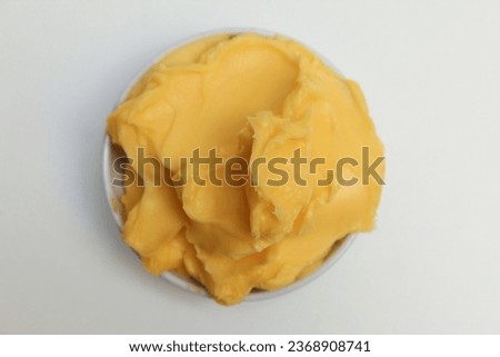 Bakery margarine in a small white bowl, isolated on white background. Spread for bakery purpose. Flat lay or top view Royalty-Free Stock Photo #2368908741