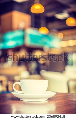 Coffee cup in coffee shop - vintage style effect picture