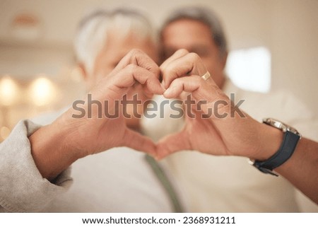 Heart hands, emoji and senior couple in home with commitment, support and marriage in retirement together. Love sign, happy man and old woman in apartment with icon for romantic gesture of loyalty. Royalty-Free Stock Photo #2368931211
