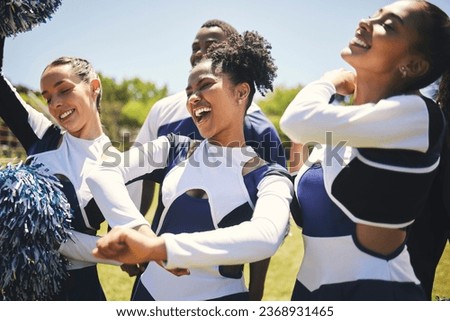 Cheerleaders, field and team with celebration, game and winner with happiness, motivation and smile. Women, men and group cheering, outdoor or chanting with sports, champion with support and excited Royalty-Free Stock Photo #2368931465