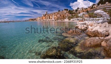 Panoramic view of colorful old town and beach in sunny Menton, French Riviera, France