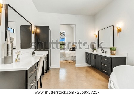 Dallas, texas - June 13th 2023: a home bathroom with a tub  Royalty-Free Stock Photo #2368939217