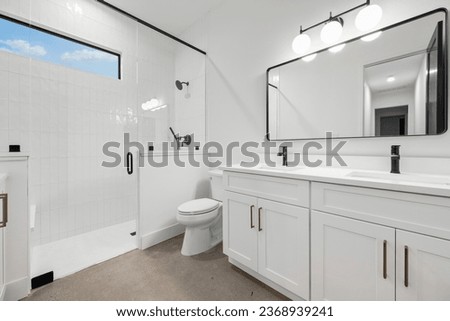 Dallas, texas - June 13th 2023: a home bathroom with a tub  Royalty-Free Stock Photo #2368939241