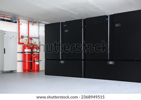 Clean agent fire suppression system used in data centers,  backup battery rooms, electrical rooms (under 400 volts), sub-floors or tape storage libraries. Royalty-Free Stock Photo #2368949515