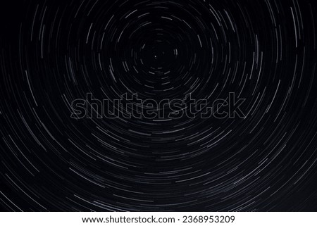 Night star trails photo, bright night with visible stars, visible earth rotation. Ideal background photo