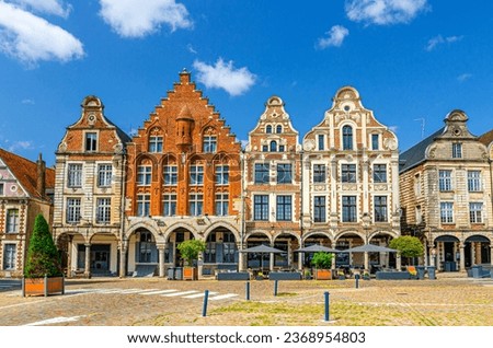 Flemish-Baroque-style townhouses buildings on La Grand Place square in Arras historical city center, blue sky in summer day, Artois, Pas-de-Calais department, Hauts-de-France Region, Northern France Royalty-Free Stock Photo #2368954803
