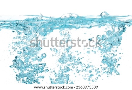 Drinking water pouring into clear glass. Bubbles inside from pouring falling clear water. Drinking soda water flush air bubble. White background isolated freeze element