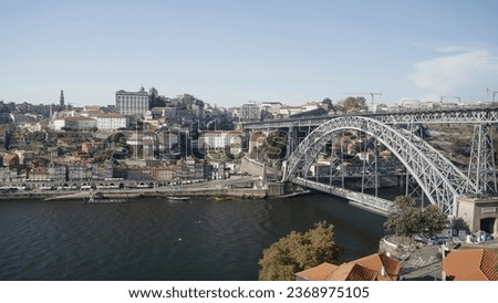 The city of Porto in Portugal, Europe, aerial skyline drone view. Action. Summer view of a beautiful city and a river with bridge. Royalty-Free Stock Photo #2368975105