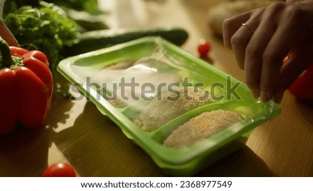 Frozen semi-finished products. Stock footage. The process of cooking cutlets with vegetables and side dishes.