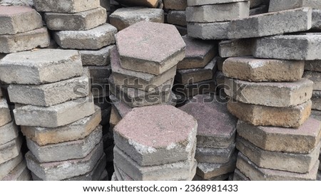 pile of red and gray rectangular cornblock stones
