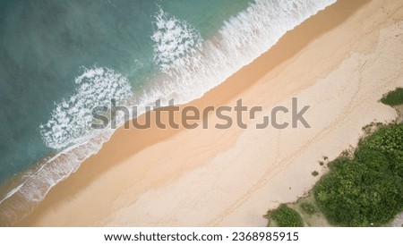 Vermelha do Norte Beach in Ubatuba - SP - with calm waters, known for surfing, nature on a cloudy day, tropical forest, landscape and drone photography, with aerial view in high resolution