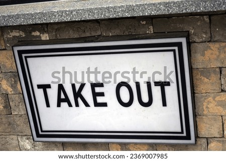 Take-out acrylic sign posted in front of the coffee shop                               