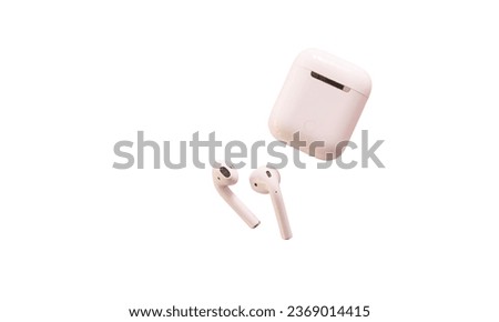 Modern wireless ear buds headphones isolated on white background.