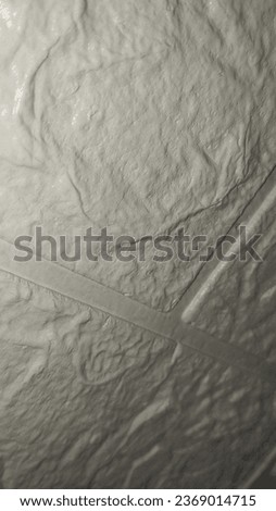 Close-up of a wall covered with a plastic film. White ceramic tile wall texture background. White ceramic tile wall texture. Background