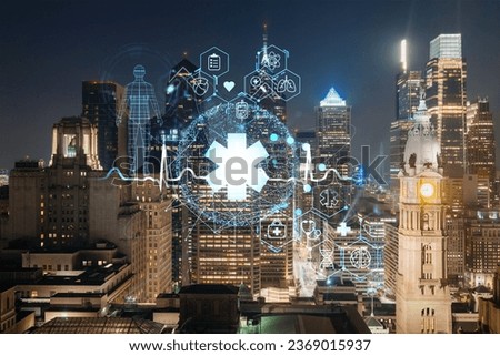 Aerial panoramic cityscape of Philadelphia financial downtown at night time, Pennsylvania, USA. Hologram healthcare digital medicine icons. The concept of treatment from disease, Threat of pandemic