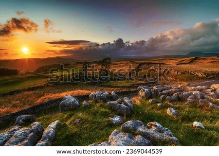 Dramatic sunset over beautiful scenery at the Winskill Stones near Settle in the Yorkshire Dales Royalty-Free Stock Photo #2369044539