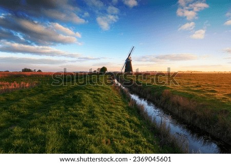 Mutton's Mill on the marshes near Halvergate and on the long distance walking route called the Weaver's Way Royalty-Free Stock Photo #2369045601