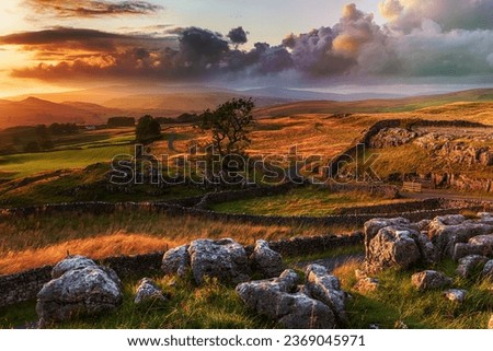 A beautiful sunset over the Yorkshire Dales National Park at the Winskill Stones near Settle Royalty-Free Stock Photo #2369045971