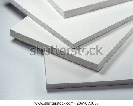PVC white plastic sheets. Light and durable foam board. Rigid and lightweight polyvinyl chloride Royalty-Free Stock Photo #2369090057