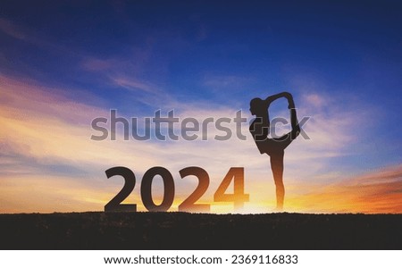 New year 2024 healthy concept, Silhouette fitness woman yoga with sunset sky background Royalty-Free Stock Photo #2369116833