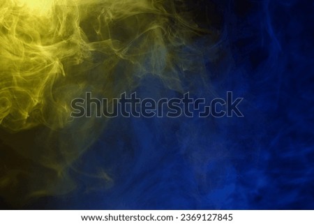 Yellow and pink steam on a black background. Copy space.
