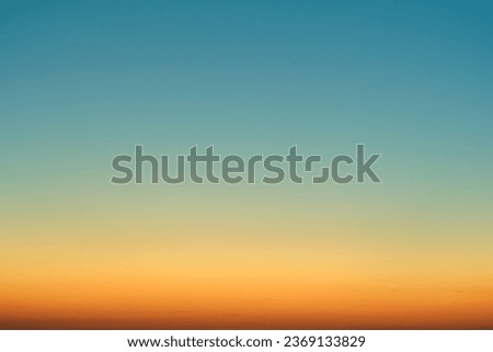 Orange-blue gradient of clear cloudless sky during sunrise
