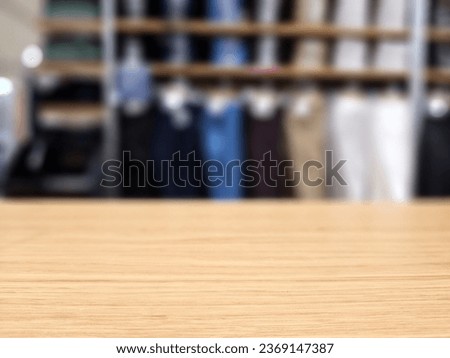 Wooden Table in Selective Focus with Blurred Boutique Store Background, Suitable for Product Presentation Backdrop, Display, and Mock up.