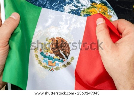 mexico flag clutching in hands