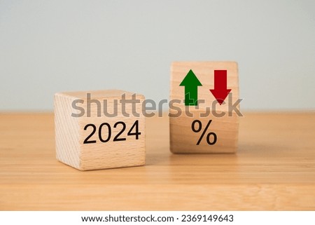 Year 2024 business concept. Economic and financial analysis, interest rates, stocks, bonds, ranking, mortgage, loan rates, Percent, up or down, arrow symbol, close up, copy space Royalty-Free Stock Photo #2369149643