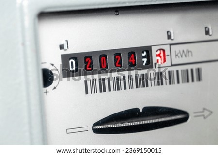 Electricity 2024, energy price in the new year, Economic concept, Electricity increase, Household meter showing red digits with the year 2024 Royalty-Free Stock Photo #2369150015
