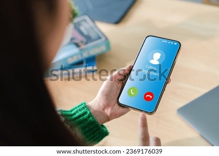 Human use smartphone with incoming call from unknown number, spam, prank caller, hoax person, fake identity, scammer, scam with mobile phone, hacker, call center, crime, call, fraud or phishing  Royalty-Free Stock Photo #2369176039