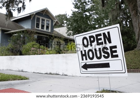 Open house sign outside historic suburban home