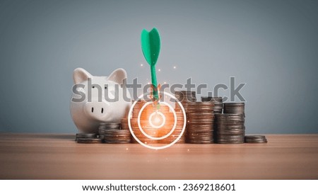 Piggy bank and coins lined up on a wooden background with target icons on a white background. Financial concepts, savings and investments