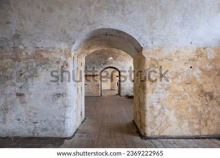 Felixstowe, UK - September 16 2023: Interior of military building of historical value - Landguard Fort. Arched doorway through many rooms. Royalty-Free Stock Photo #2369222965