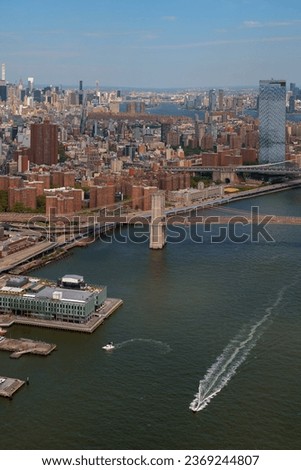 Aerial view about the Brooklyn bridge in Newy York city, Lower Manhattan. Next to the One world trade center building. This bridge connect Manhattan to Brooklyn.