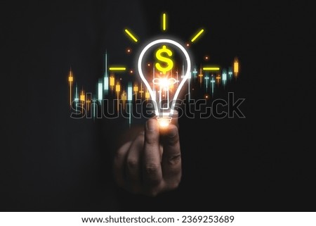 Business growth, advancement, financial success skills or success Businessman holds light bulb icon and money with graph Concept of financial growth, investment