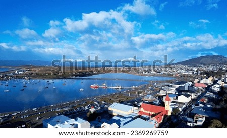 Harbor at downtown Ushuaia Argentina at Tierra del Fuego. Natural landscape of scenic harbor port at city. Ushuaia Argentina. Patagonia Argentina at Ushuaia Tierra del Fuego Argentina. Downtown city. Royalty-Free Stock Photo #2369269759